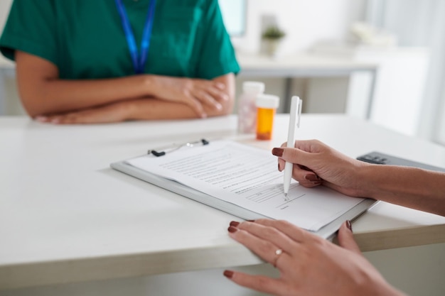 Female Patient Filling Medical Form