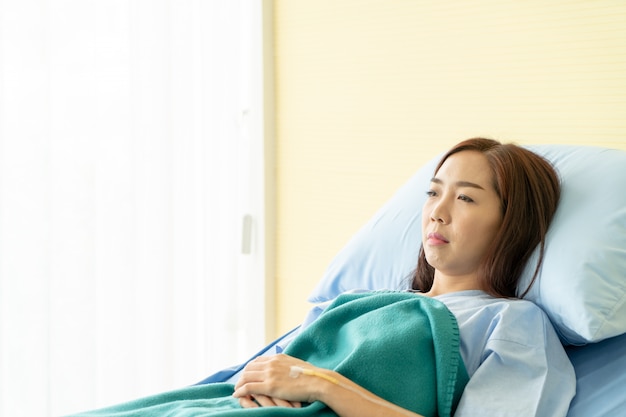 female patient on hospital bed