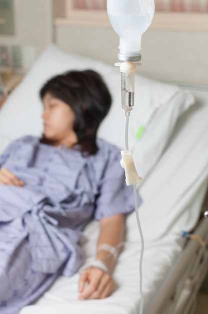 Female patient sleeping on hespital bed