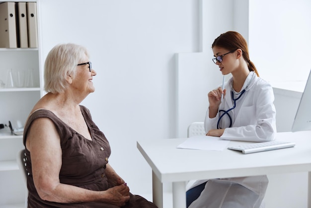 Female patient talking to a doctor stethoscope High quality photo