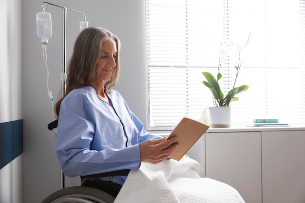 Photo female patient in wheelchair indoors