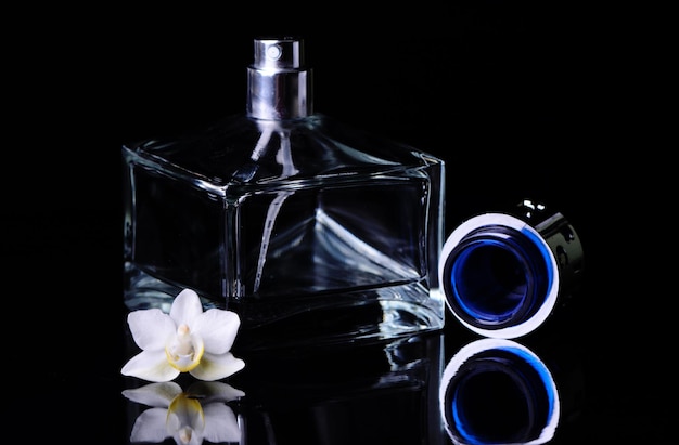 Photo female perfume on a black background