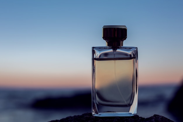 Female Perfume on sunset background