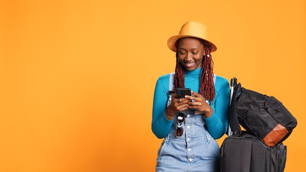 Female person texting messages on phone app, browsing online social media page on holdiay trip. young tourist leaving on international urban getaway, using internet network on smartphone