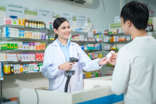 Female pharmacist counseling customer about drugs usage in a modern pharmacy drugstore