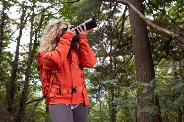 Female photographer in the forest