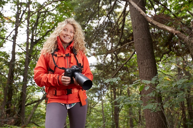 Female photographer in the forest