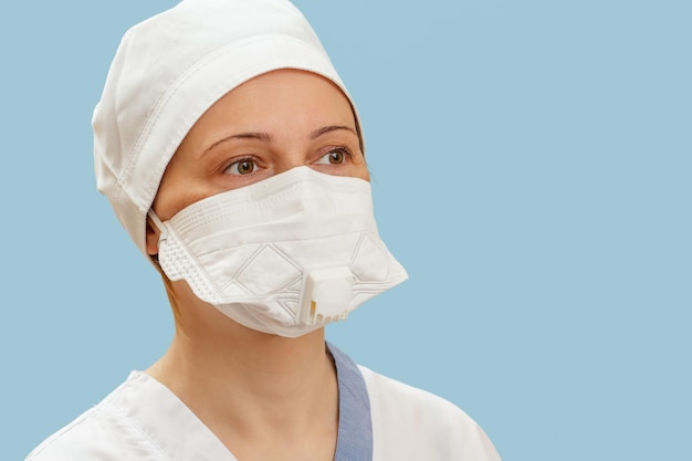 Female physician in medical uniform and a medical face mask as a protection against airborne viruses