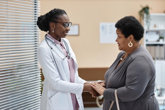 Female physician welcoming patient in clinic