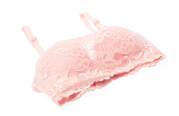 Female pink lace bra isolated on white background