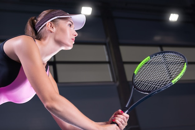 Female player holding a tennis racket