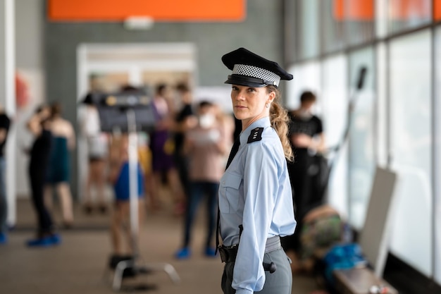 Female police officer in uniform on duty during a public event