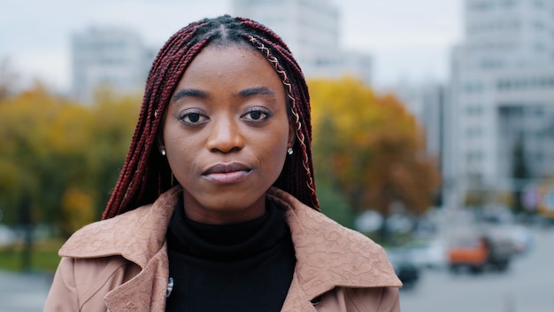 Female portrait closeup young serious pensive beautiful stylish african american woman standing