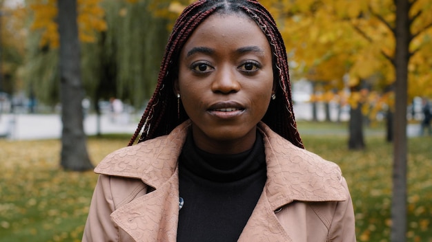 Female portrait closeup young serious pensive beautiful stylish african american woman standing