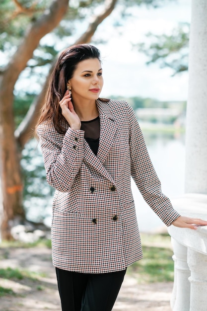 Female posing in pantsuit outdoors