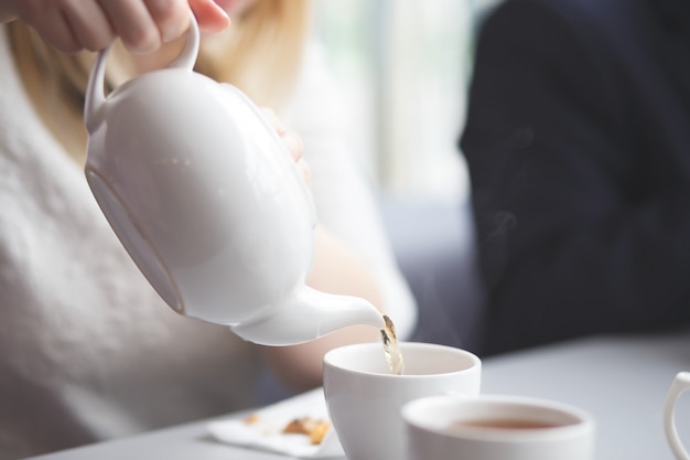 Female pouring tea