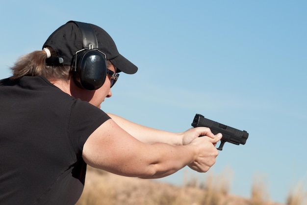 Female practicing target shooting.