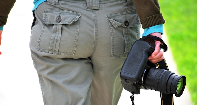 Female professional photographer on an assignment walking to her destination