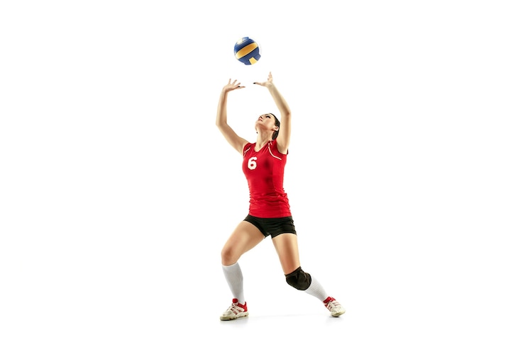 Photo female professional volleyball player isolated on white with ball. the athlete, exercise, action, sport, healthy lifestyle, training, fitness concept