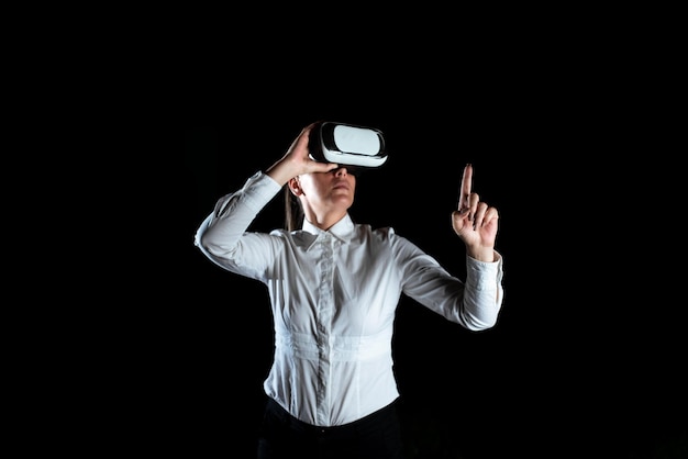 Female Professional Wearing Virtual Reality Headset Gesturing And Enjoying Simulator Elegant Businesswoman Presenting Modern Technology And Using Futuristic Gadget
