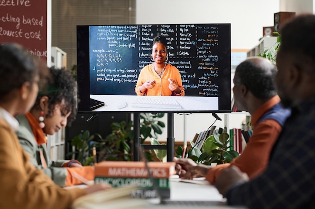 Female professor on computer screen giving online class