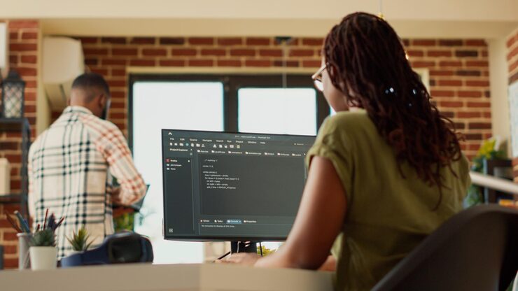 Photo female programmer using code to develop online app, working with html script on terminal window to program database software. it manager planning artificial intelligence network. handheld shot.