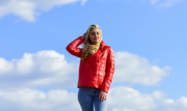 Female psychology Girl red jacket cloudy sky Wind of changes Woman fashion model outdoors Woman enjoy cool weather Fashion outfit Windy day Matching style and class with luxury and comfort