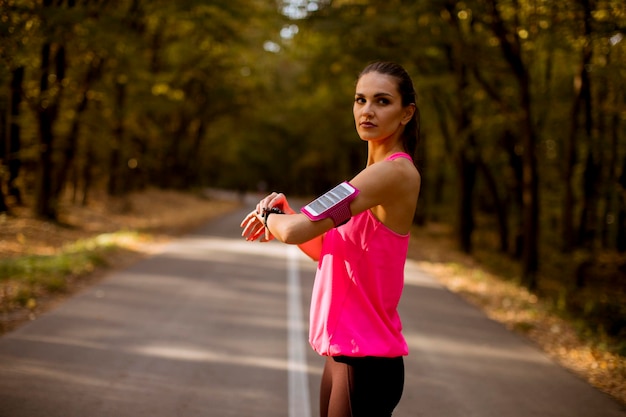 Female runner during outdoor workout in beautiful autumn mountain nature landscape