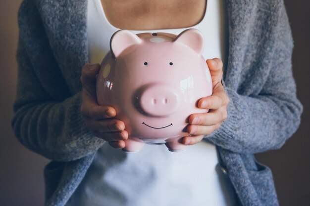 female saving money for household payments bank bills calculating monthly family budgets