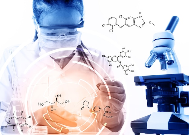 Female scientist examining chemical in laboratory