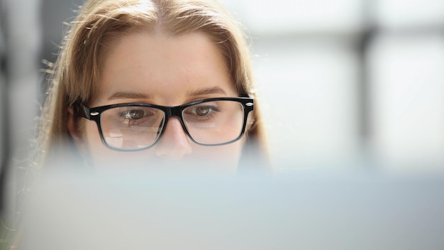 Female scientist manipulate and program the robot for work