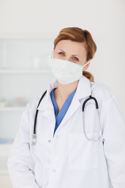 female scientist with a mask posing