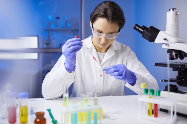 Female Scientist Working in Laboratory