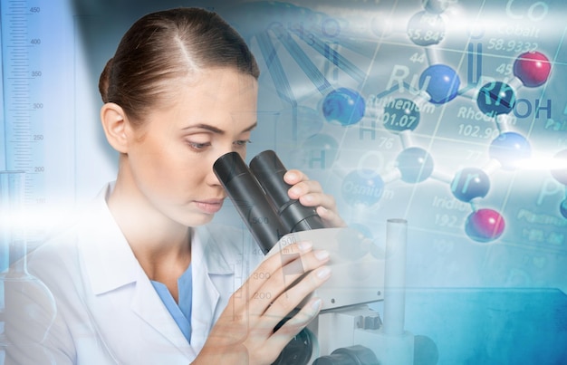 Female Scientist Working with Microscope in Laboratory