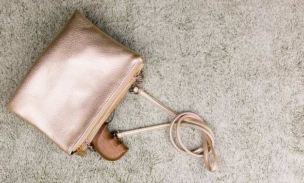 Female selfdefense A pistol peeping out of a woman's handbag