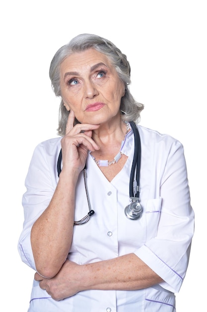 Female senior doctor on white background