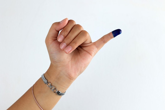 Photo female showed hand with ink for indonesian election or pemilu presiden