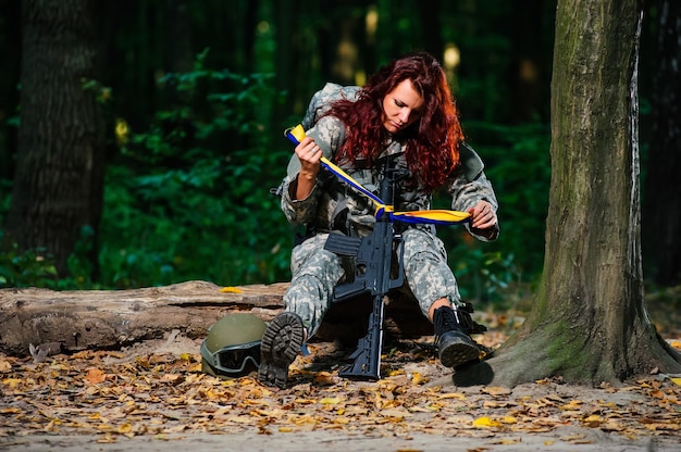 Female soldier in the forest