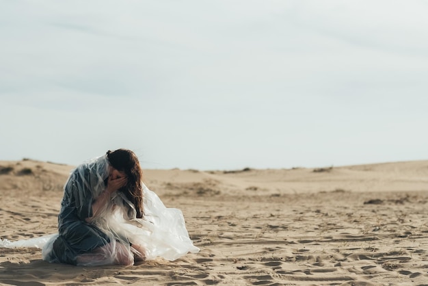 Female sorrow emotional crisis woman sand desert