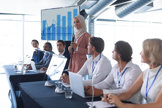 female speaker speaks in a business seminar