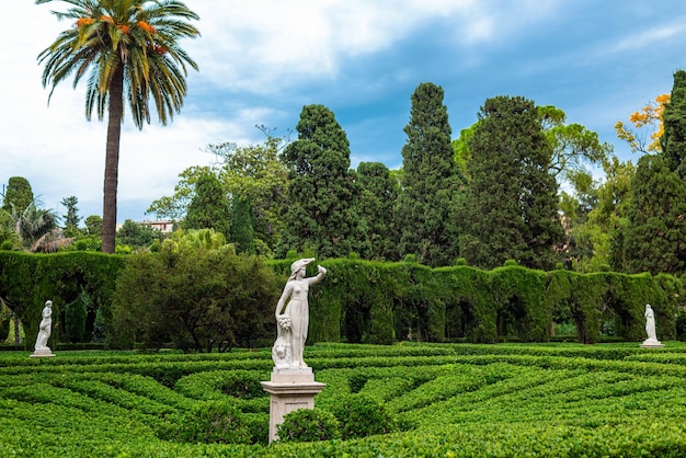 Female statues in a park with greenery. Valencia. Spain.