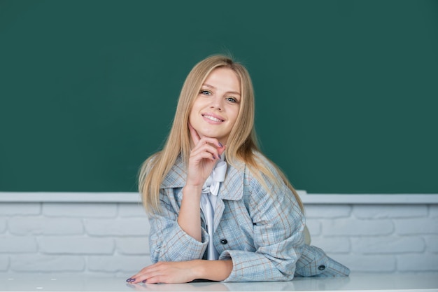 Female student on lesson lecture in classroom at high school or college positive emotions of cute sc...