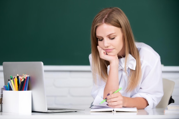 Female student on lesson lecture in classroom at high school or college Student education concept Female student thinking about coursework in university