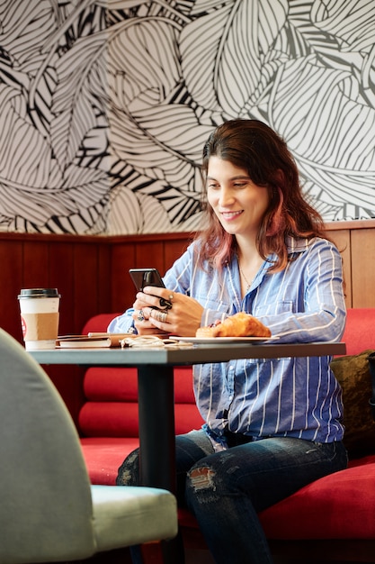 Female student resting in cafe