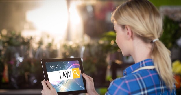 Female student searching for law studies on tablet PC