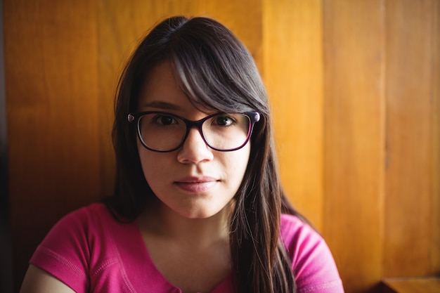 Female student sitting in college