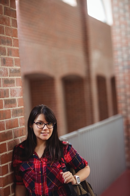 Female student standing in corridor