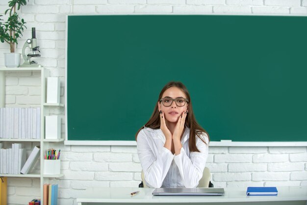 Female student in university school education young woman study\
in college classroom surprised student in class amazed school\
girl