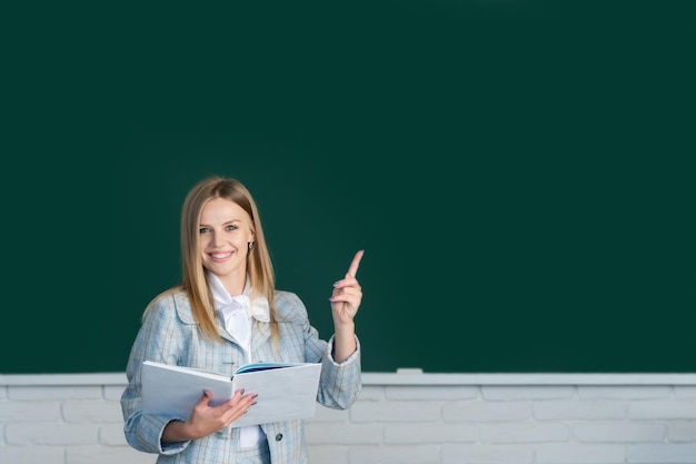 Female student with pointing finger in university school education young woman study in college clas