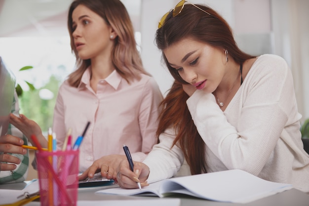 Female students working on a project together